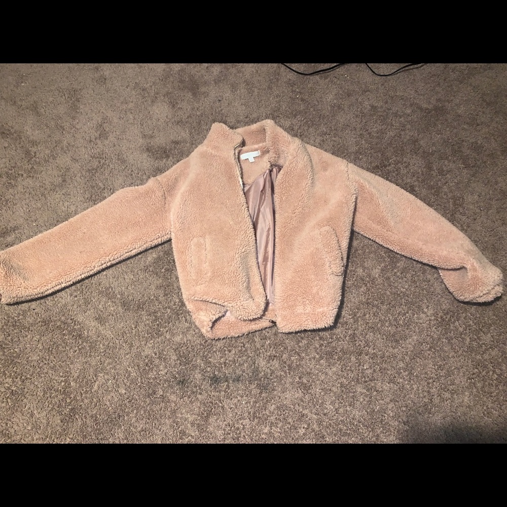 Pink fuzzy jacket.